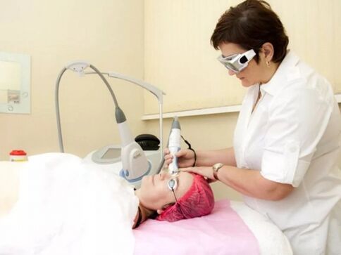 Beautician performs laser rejuvenation surgery